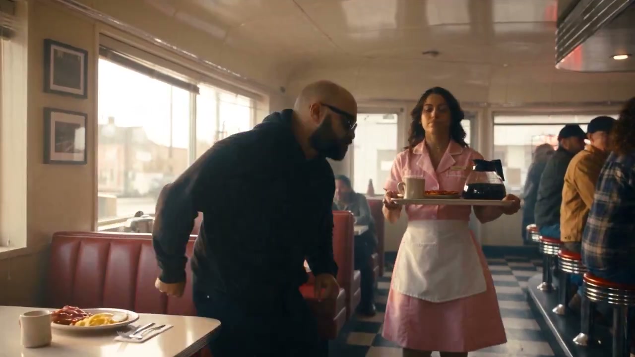 Photorealistic 1990s diner collision — frozen time, bacon grab, then chaos snaps back